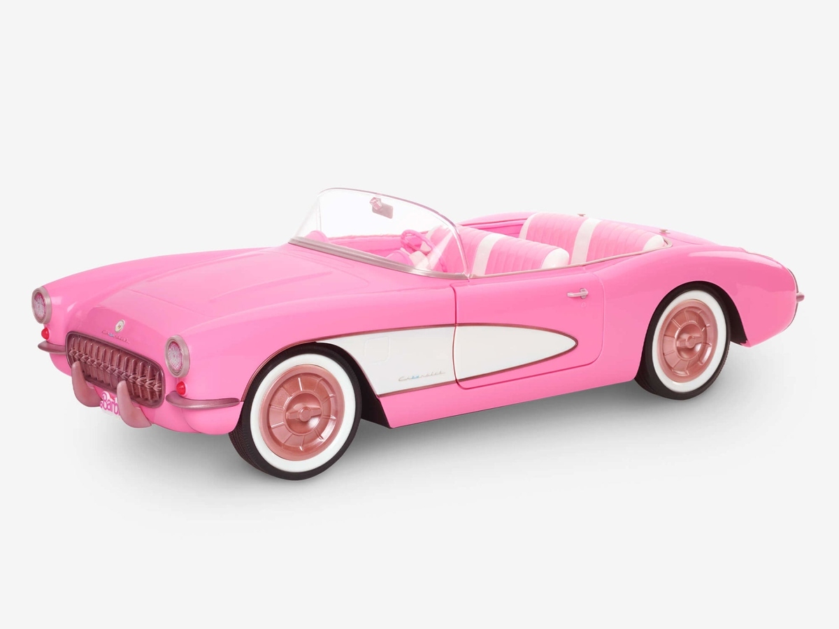 A pink Barbie Corvette toy car on a white background