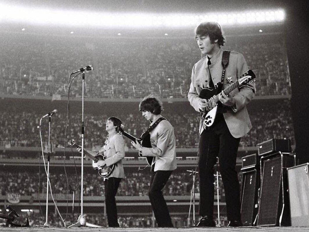 The Beatles performing at Shea Stadium in 1965