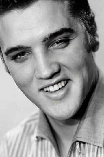 Elvis Presley smiling in a 1956 publicity portrait