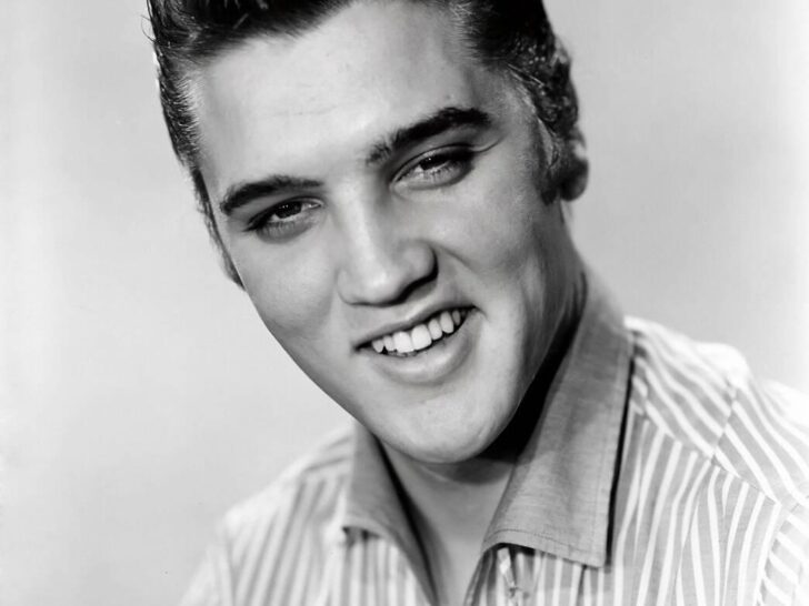 Elvis Presley smiling in a 1956 publicity portrait