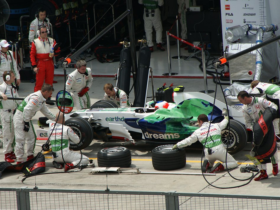 Formula 1 Honda team completing a pit stop during the Malaysian Grand Prix