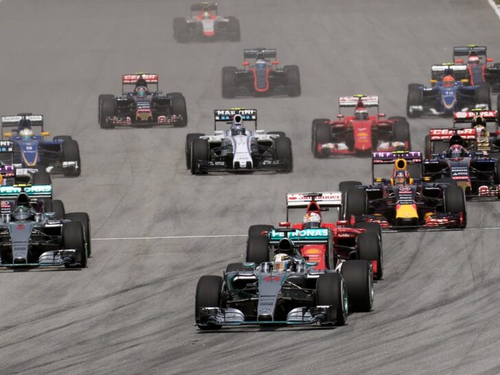 Formula 1 cars racing on the opening lap of the Malaysian Grand Prix