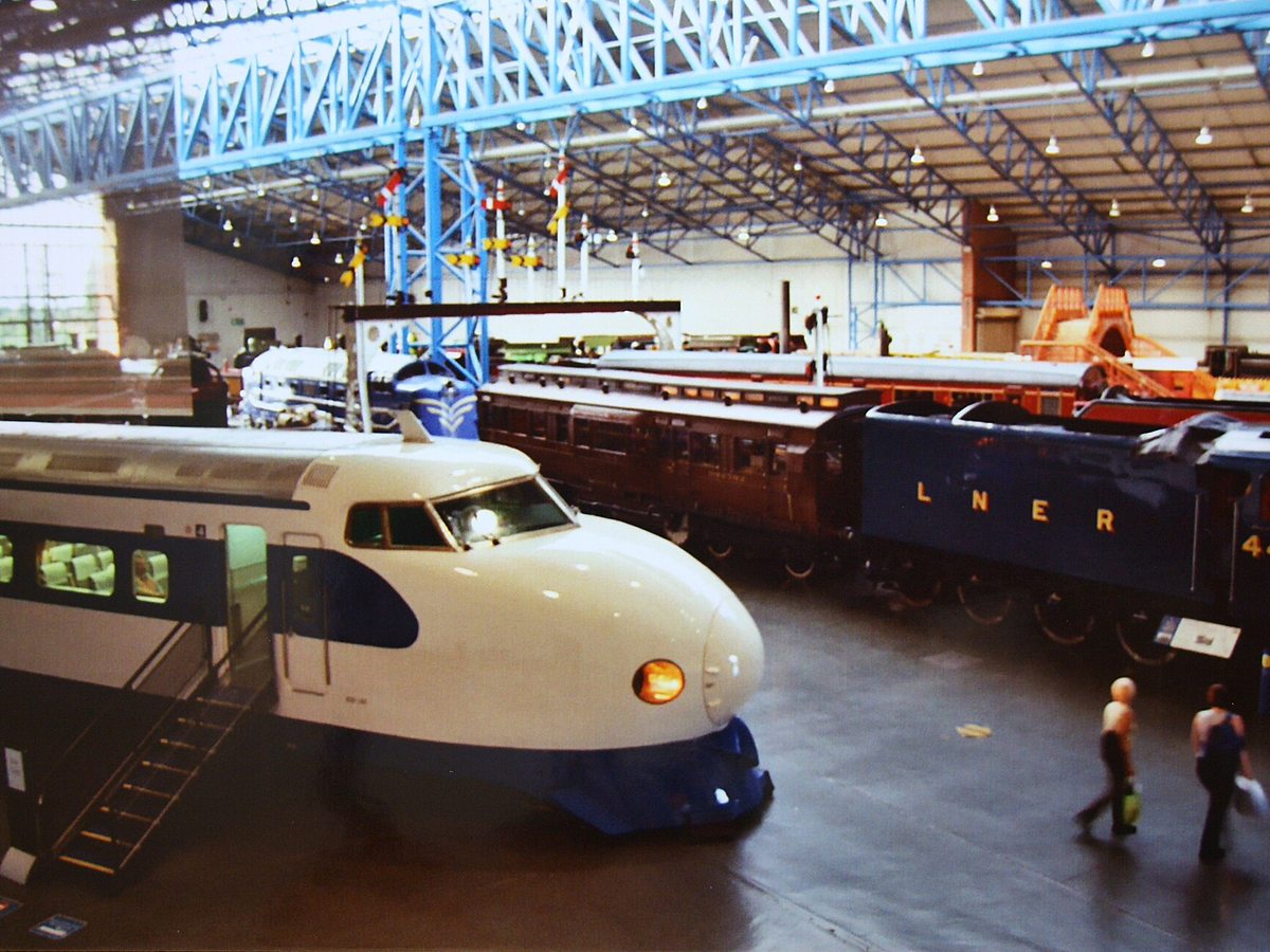 Japanese Shinkansen bullet train traveling on railway tracks