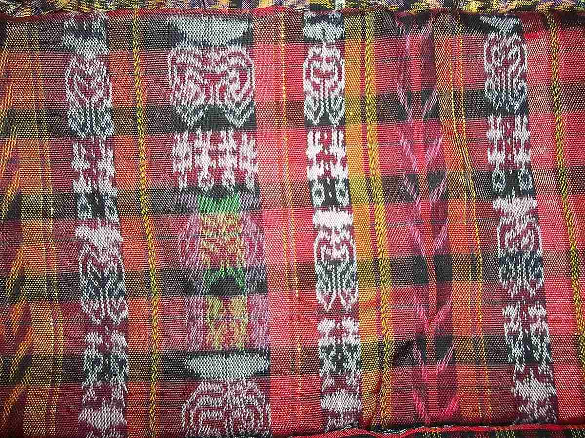 Colorful traditional Maya textile with intricate woven geometric patterns