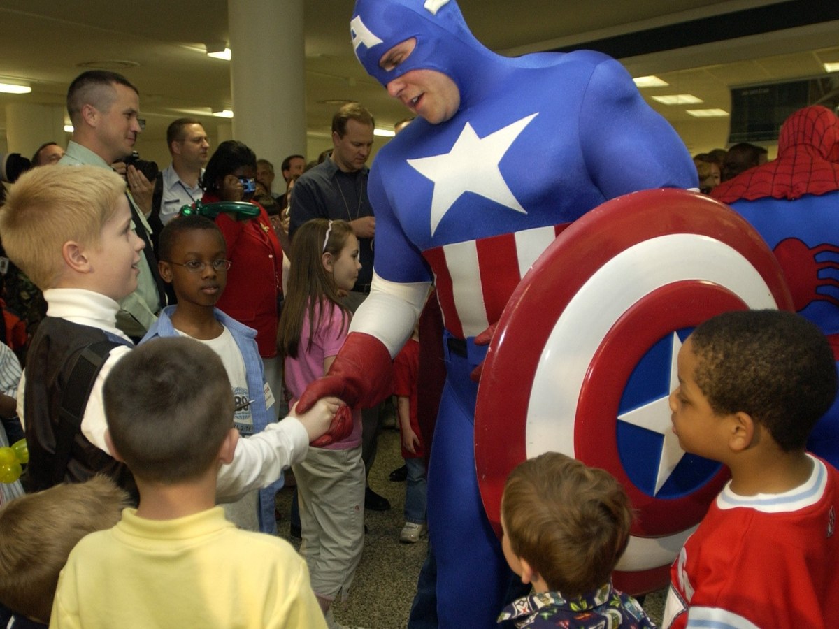 Captain America cosplayer holding his shield