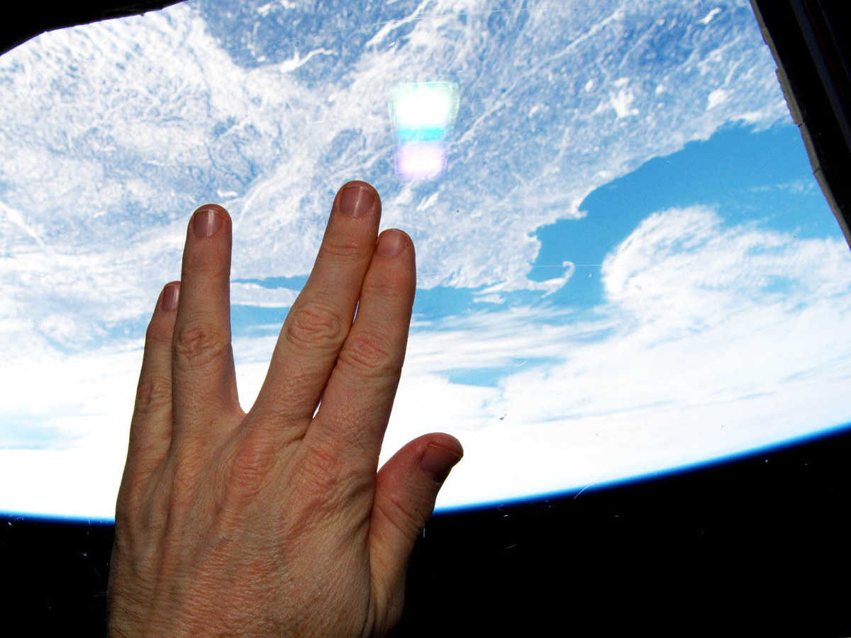 Astronaut giving the Vulcan salute from orbit