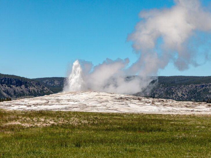 Old Faithful geyser erupting in Yellowstone National Park