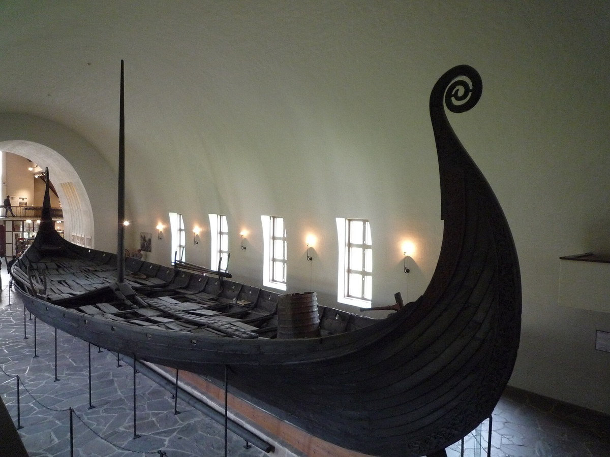 Preserved Oseberg Viking ship displayed in a museum