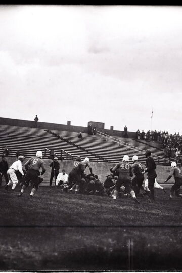 Historic black-and-white photograph of an Aggies versus BYU college football game