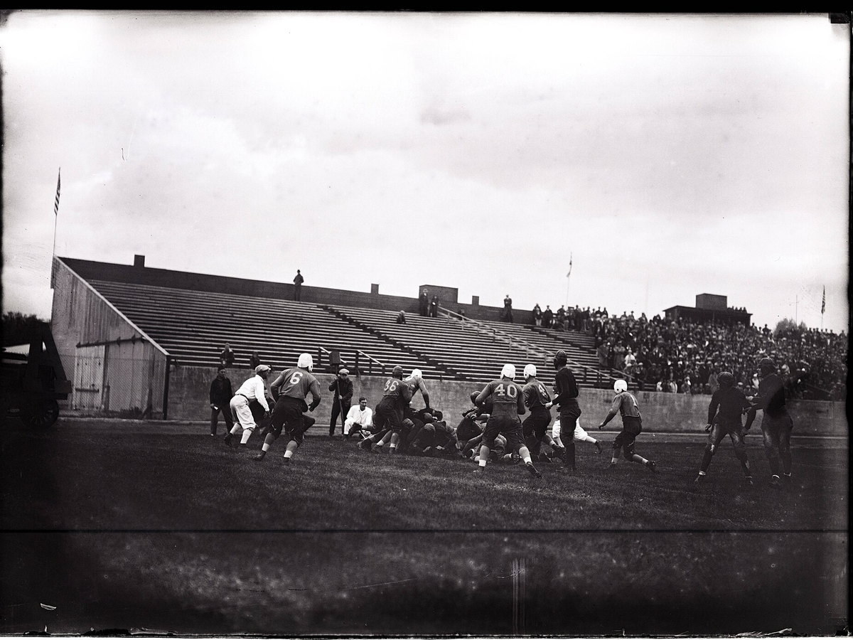 Historic black-and-white photograph of an Aggies versus BYU college football game