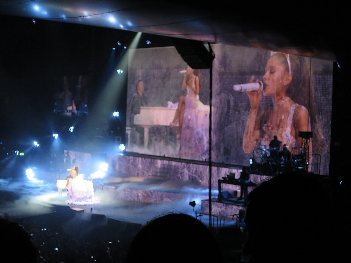 Ariana Grande sings onstage during a concert in Berlin