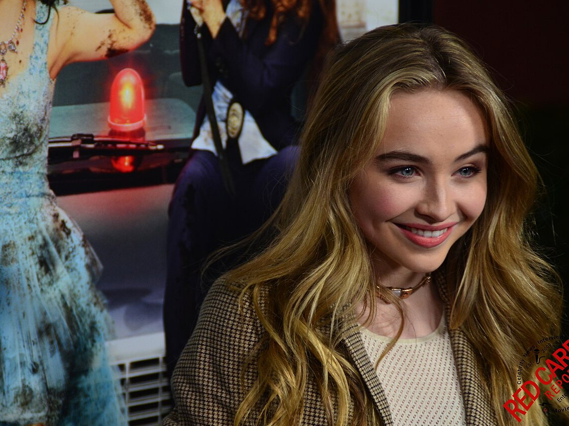 Sabrina Carpenter poses at a Disney Channel premiere event at Walt Disney Studios