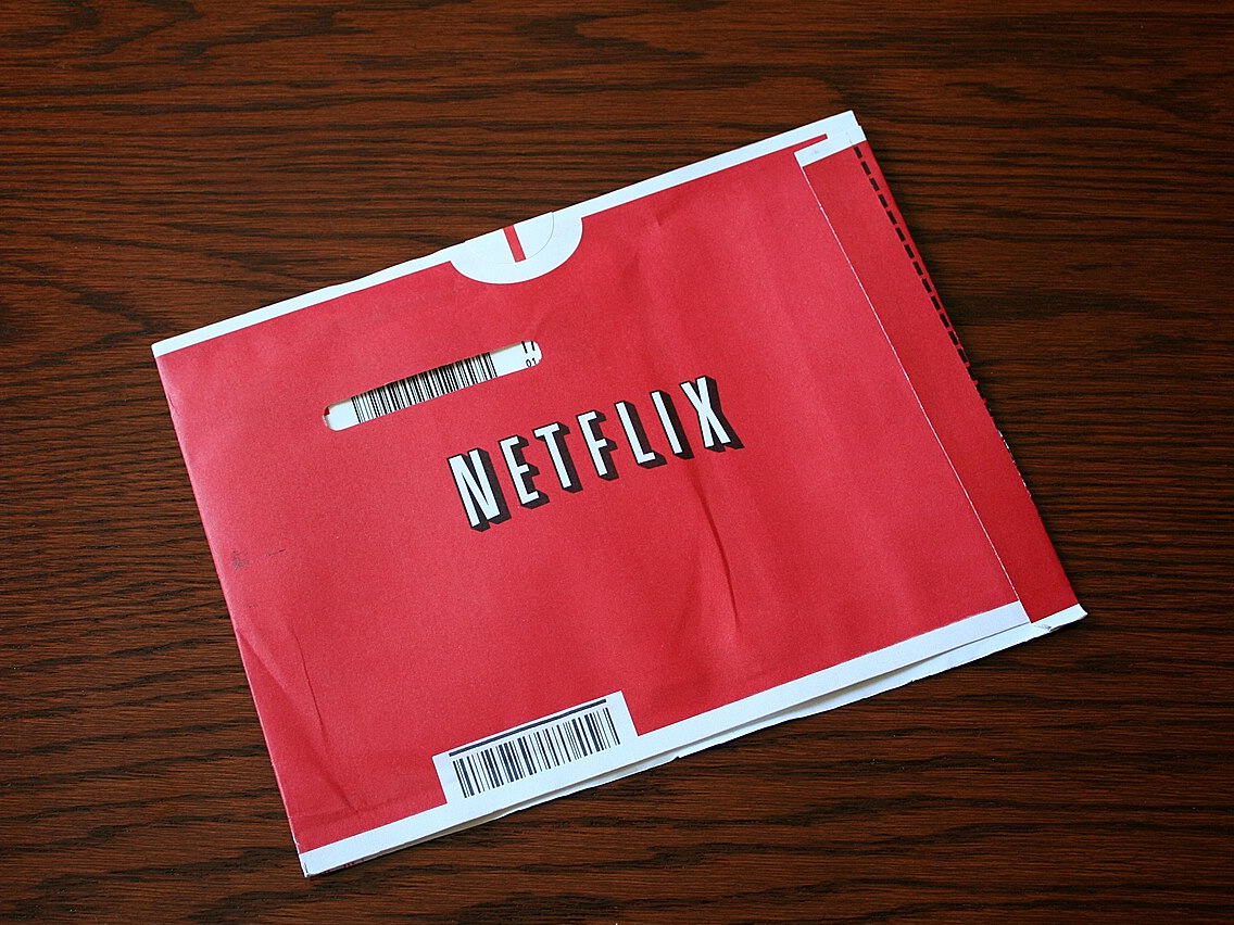 A red Netflix DVD-by-mail envelope
