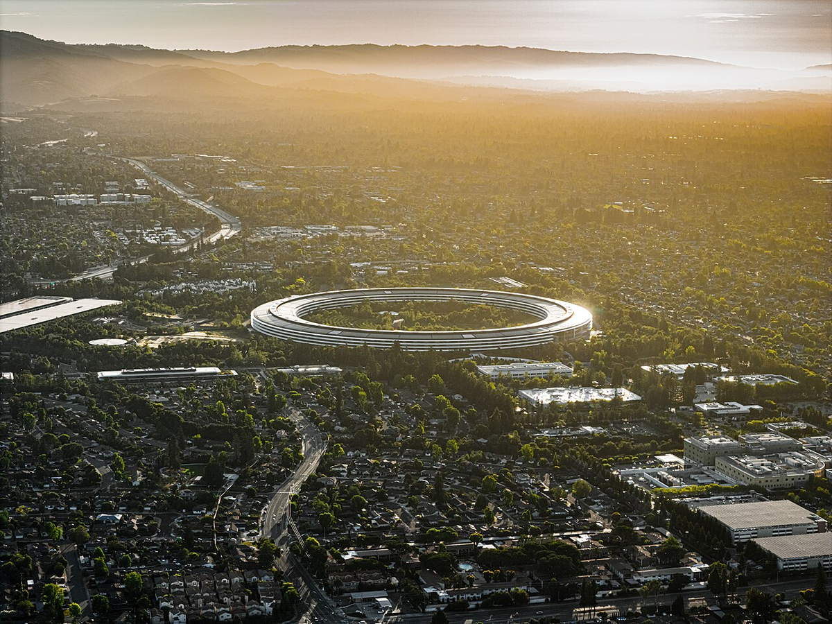Aerial view of the circular Apple Park headquarters in Cupertino at sunset
