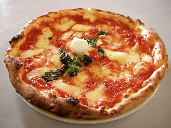 Traditional Neapolitan pizza Margherita with tomato, mozzarella, and basil
