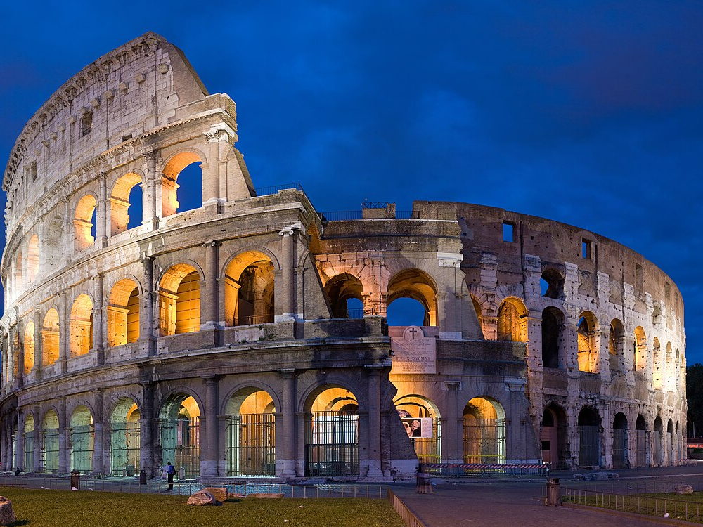 Panoramic view of the Colosseum in Rome at dusk
