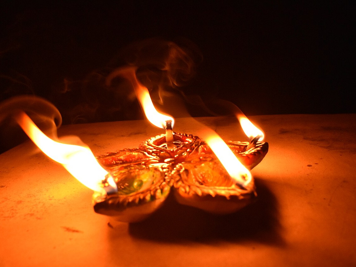 Rows of glowing Diwali oil lamps in West Bengal, India