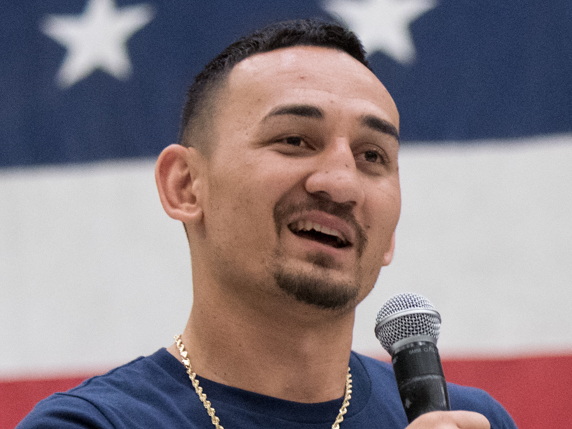 UFC featherweight champion Max Holloway speaking to troops in 2018