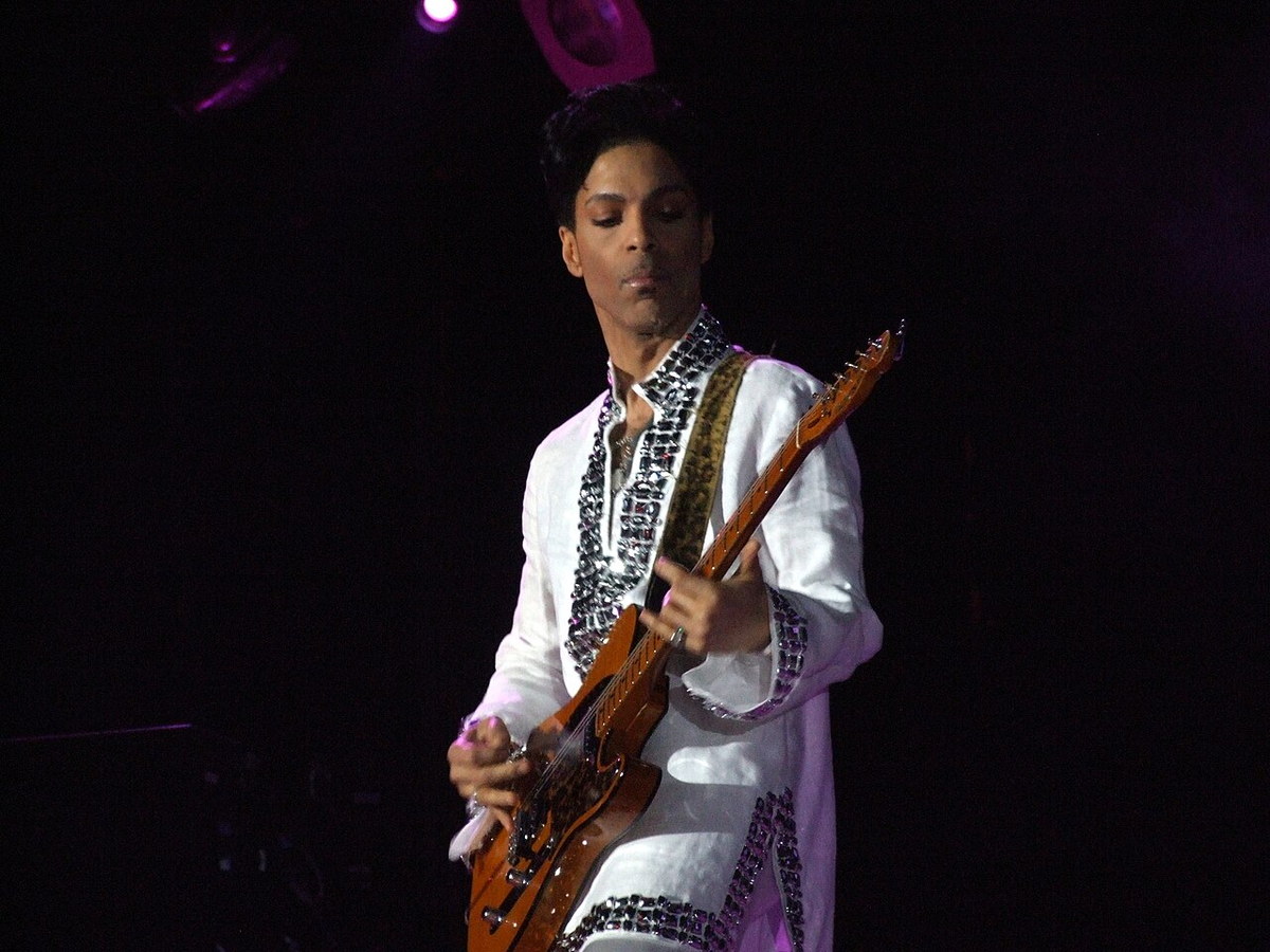 Prince performing with a guitar at the Coachella music festival
