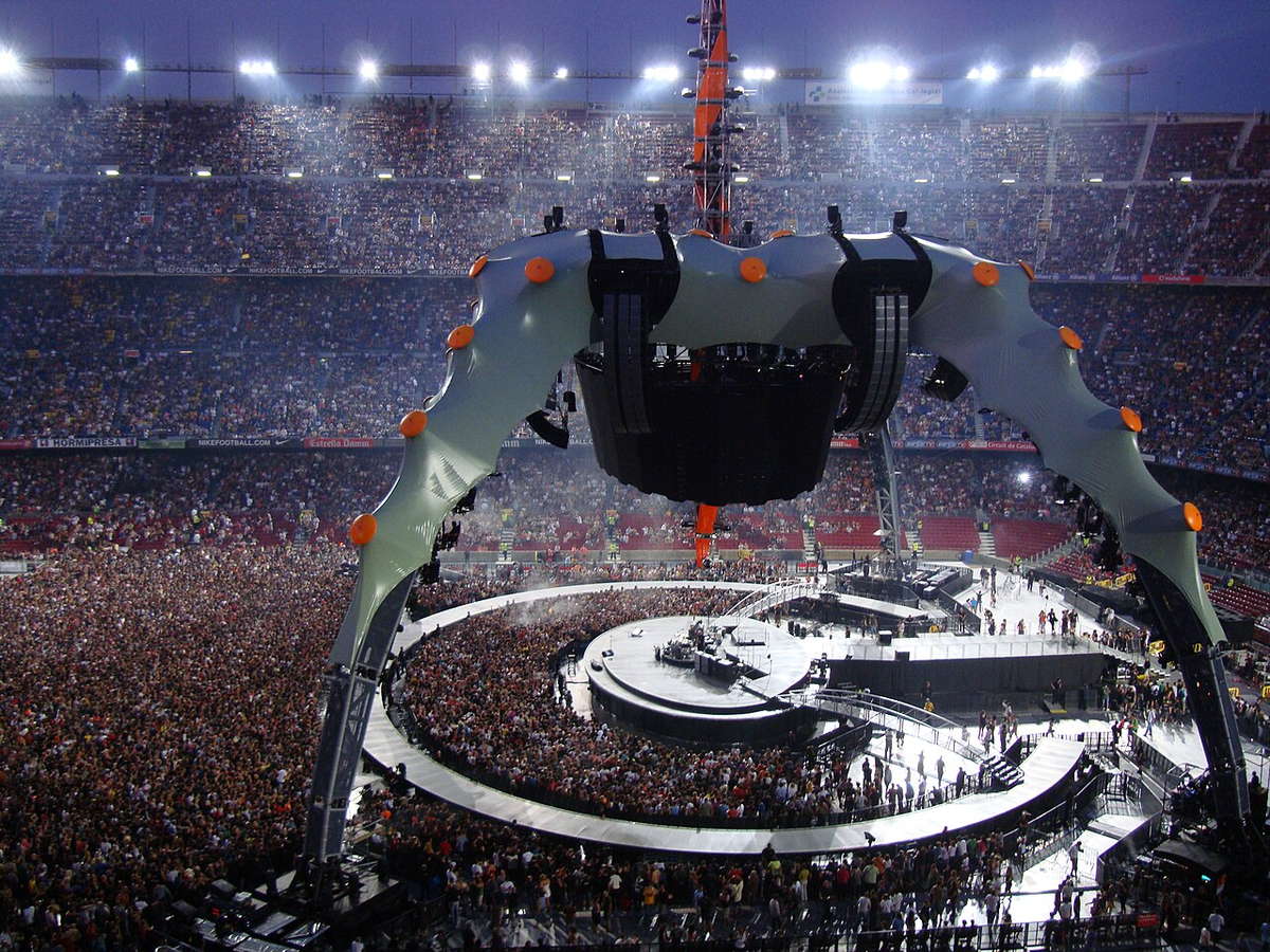 U2 performing beneath the Claw stage during the 360 Tour in Barcelona