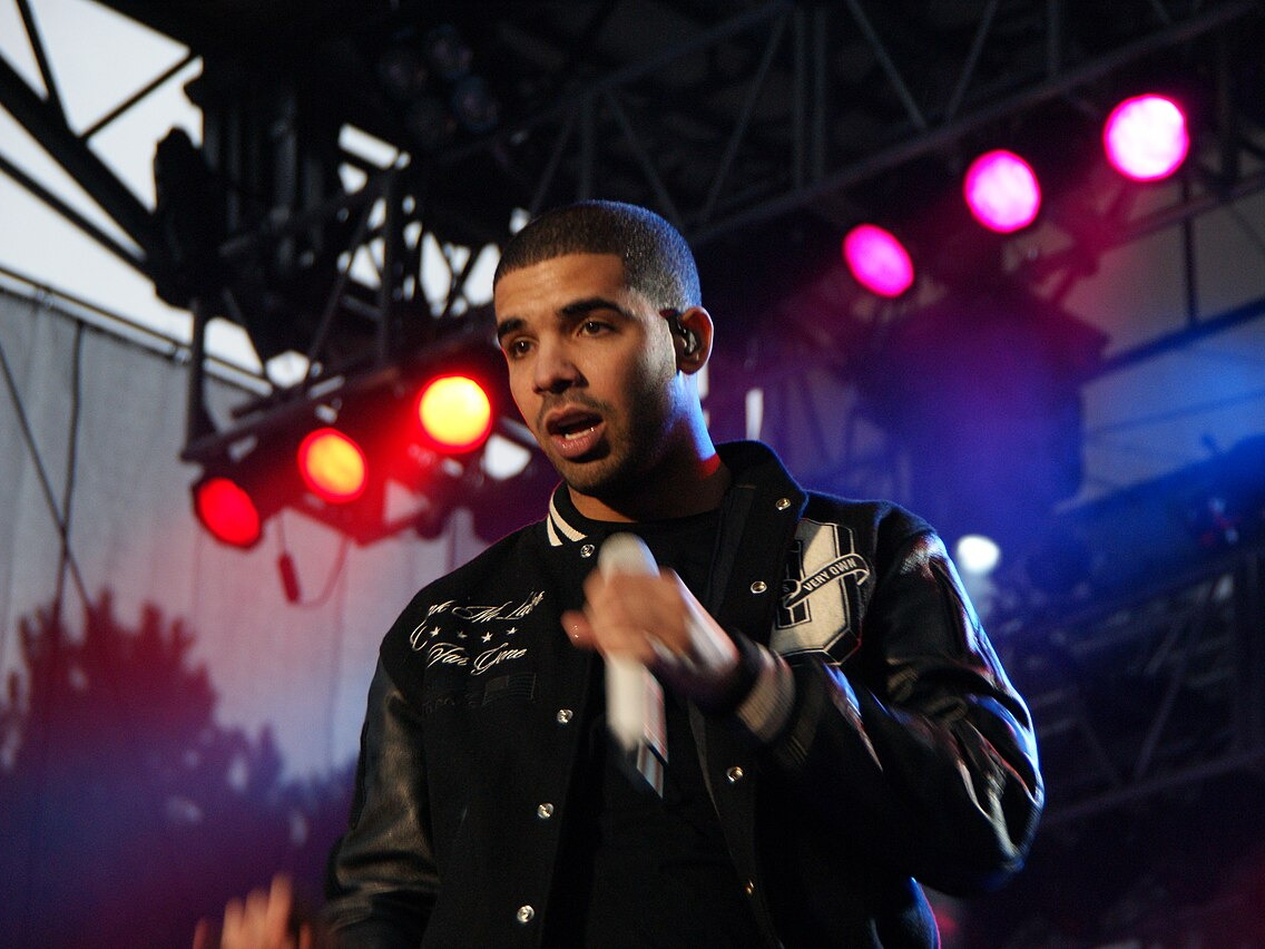 Drake performing onstage in 2010