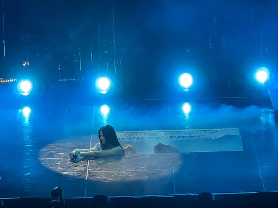 Dua Lipa performing on the Future Nostalgia Tour in 2022
