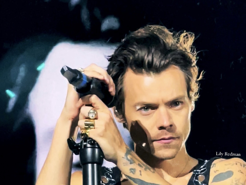 Harry Styles performing at Wembley Stadium during Love on Tour in 2022