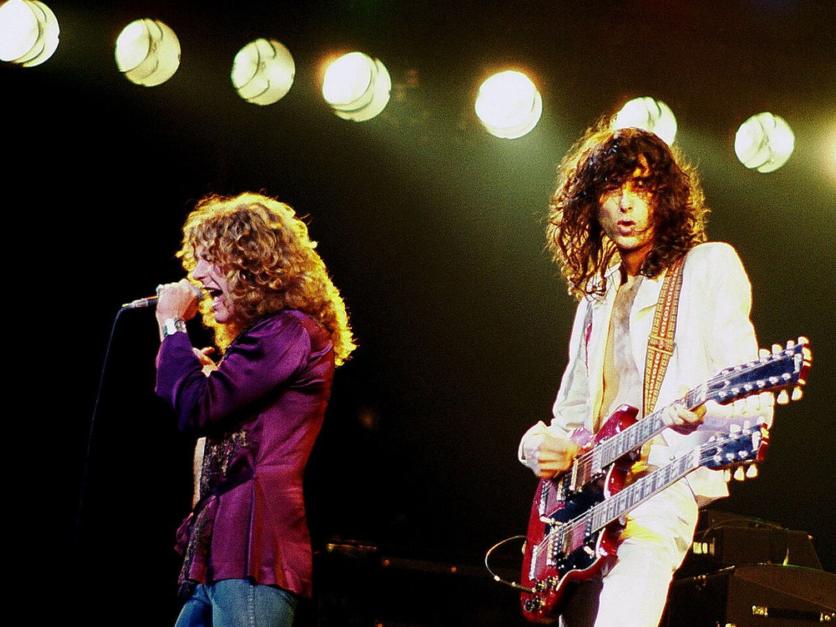 Jimmy Page and Robert Plant performing with Led Zeppelin in 1977
