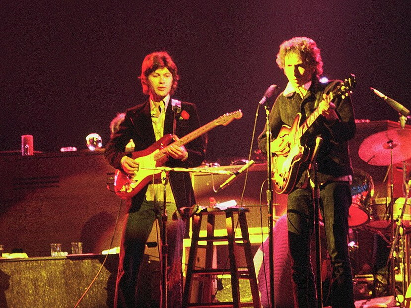 Bob Dylan performing onstage with The Band in 1974