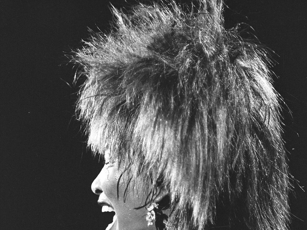 Tina Turner performing energetically onstage in Los Angeles in 1984