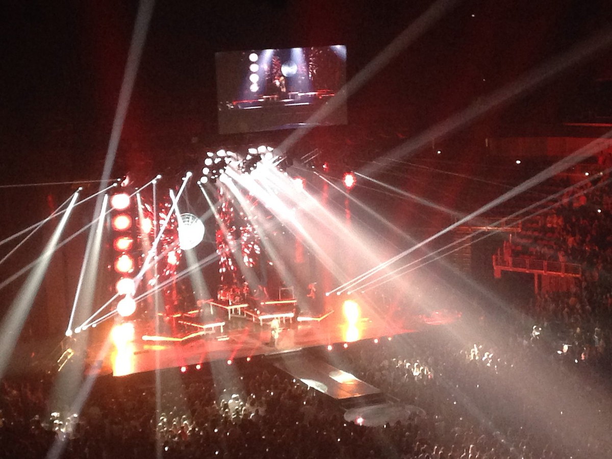 Shania Twain singing onstage during a live concert in 2015