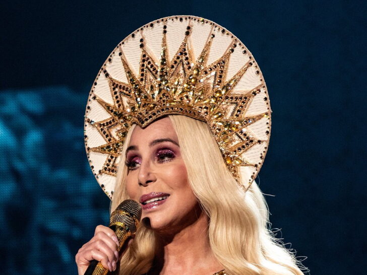 Cher singing onstage during a live performance in 2019