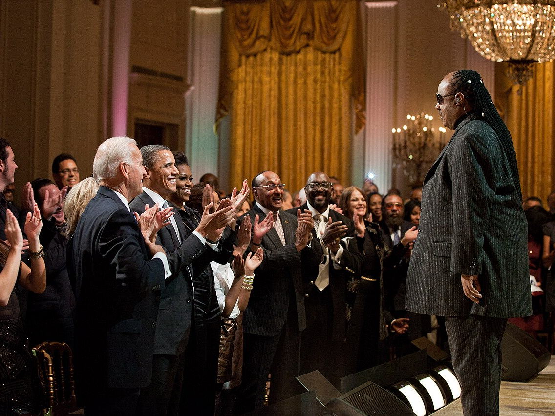 Stevie Wonder receiving a standing ovation in the White House East Room in 2011
