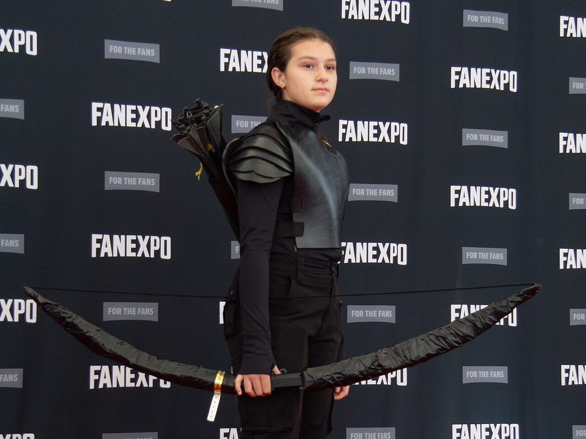 Katniss Everdeen cosplay with a bow inspired by The Hunger Games