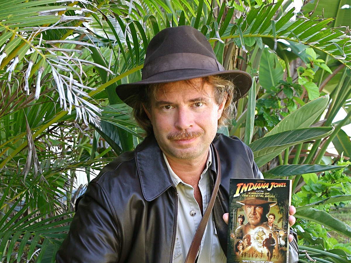 Indiana Jones cosplay wearing the character's fedora and leather jacket