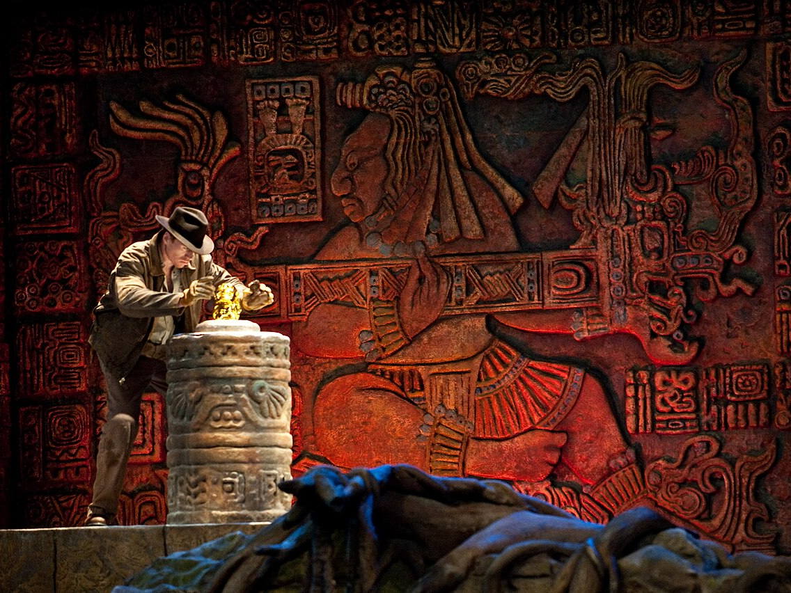 Indiana Jones stunt performer holding the golden idol at Disney's Hollywood Studios