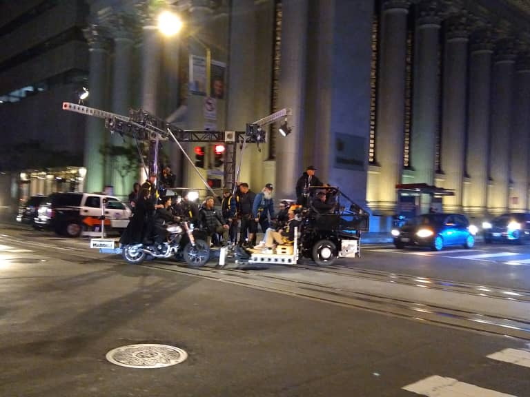 Keanu Reeves and Carrie-Anne Moss filming a motorcycle scene for The Matrix Resurrections
