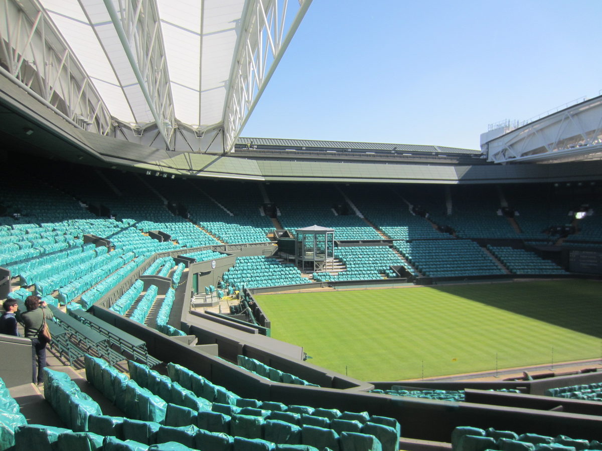 Wimbledon Centre Court with its grass surface and surrounding green seats