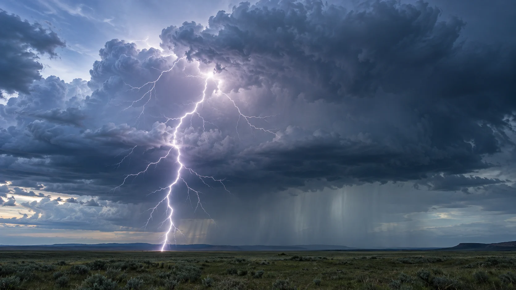 A branching lightning bolt beneath a towering prairie storm cloud