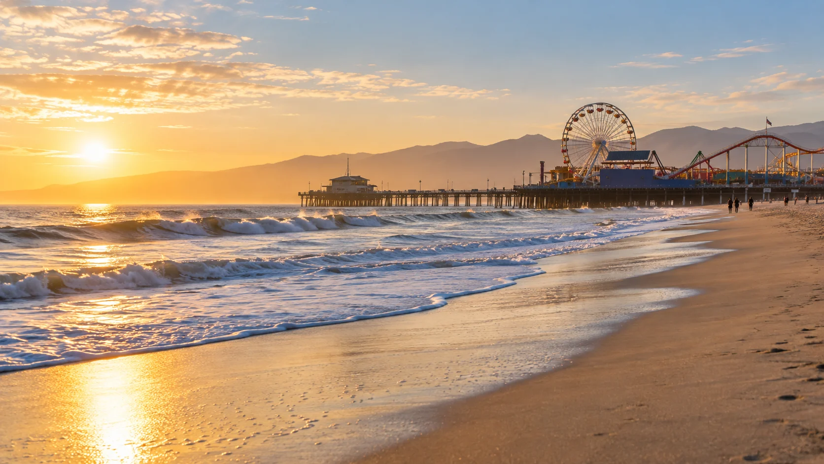 Santa Monica Pier stretches over the Pacific at golden hour
