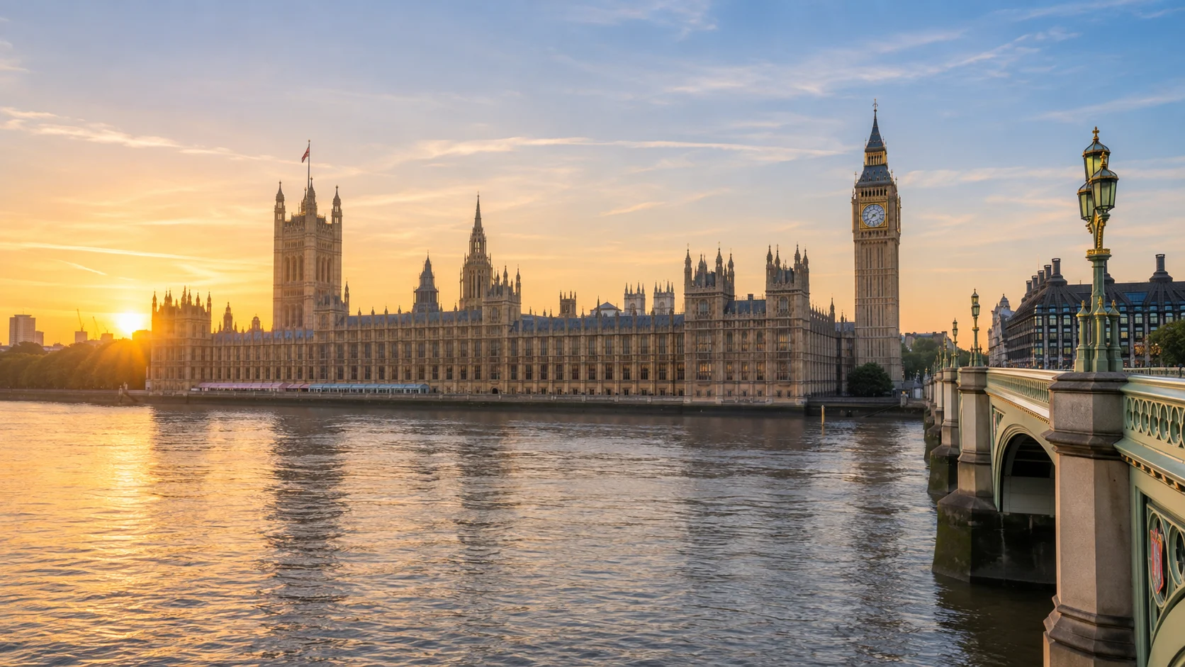 Palace of Westminster and Elizabeth Tower beside the Thames at sunrise